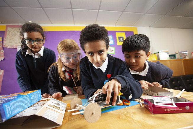 Four students making craft projects with micro:bit