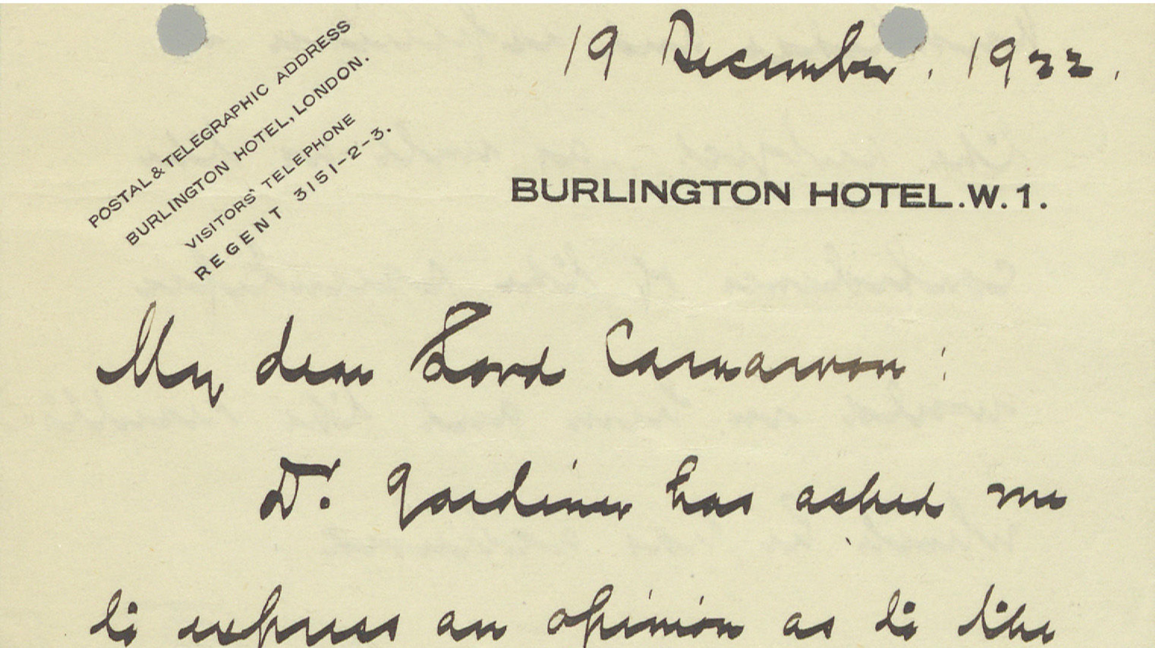 A dark cream notecard with two columns of writing in English script addressed to Howard Carter