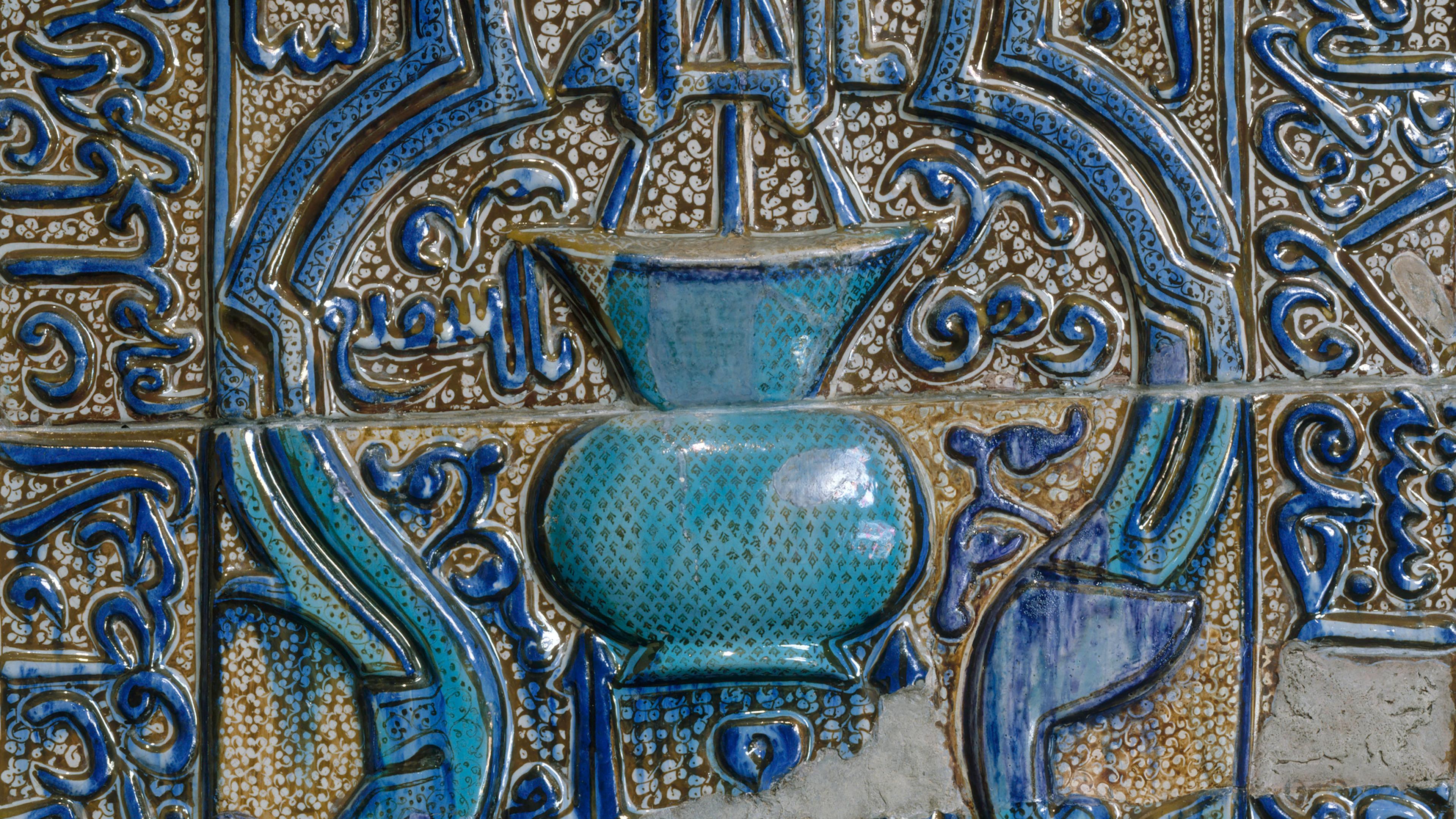 Blue, turquoise and opaque white tile panel decorated with Qur'anic verses