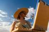 woman wearing a hat painting