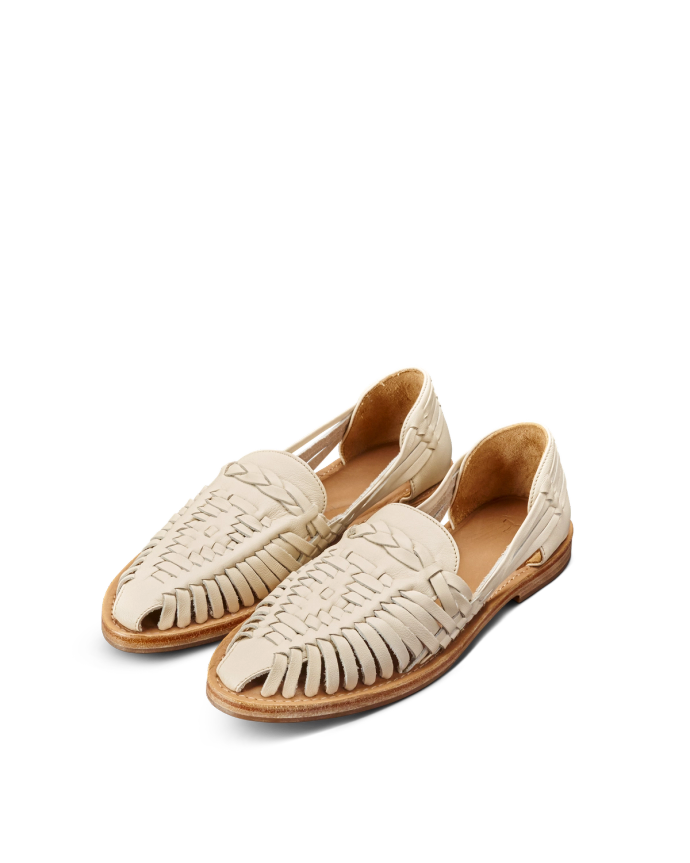 Quarterfront view of The Maya - Bone Cowhide on plain background